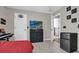 Bright bedroom with wood-look floors, large TV, and ample closet space at 1409 Sutton Island Dr, Deland, FL 32724