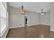 Spacious living room featuring hardwood floors and ceiling fan at 1409 Sutton Island Dr, Deland, FL 32724