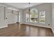 Bright dining area with hardwood floors and large windows at 1409 Sutton Island Dr, Deland, FL 32724