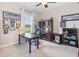 Home office with built-in shelving, large desk, and comfortable chair at 31754 Redtail Blvd, Sorrento, FL 32776