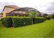 Spacious backyard with a screened patio and lush landscaping at 2718 Lido Key Dr, Kissimmee, FL 34747