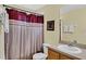 Simple bathroom with shower/tub combo and wood vanity at 2718 Lido Key Dr, Kissimmee, FL 34747