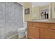 Clean bathroom with shower/tub combo and wood vanity at 2718 Lido Key Dr, Kissimmee, FL 34747