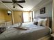 Spacious Primary bedroom with a king-size bed and crib at 2718 Lido Key Dr, Kissimmee, FL 34747