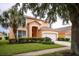 Two-story house with attached garage and manicured lawn at 2718 Lido Key Dr, Kissimmee, FL 34747