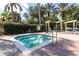 Relaxing hot tub surrounded by lush landscaping at 2718 Lido Key Dr, Kissimmee, FL 34747