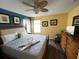 King-size bed in a spacious bedroom with a ceiling fan at 2718 Lido Key Dr, Kissimmee, FL 34747