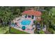 Community pool and spa with plenty of lounge chairs at 2718 Lido Key Dr, Kissimmee, FL 34747