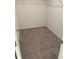 Walk-in closet with wire shelving and neutral carpeting at 153 Mandovi St, Davenport, FL 33837