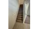 Staircase with neutral carpeting at 153 Mandovi St, Davenport, FL 33837