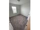 Well-lit bedroom with neutral carpeting at 153 Mandovi St, Davenport, FL 33837