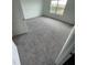 Bright bedroom featuring neutral carpeting and a window at 153 Mandovi St, Davenport, FL 33837