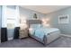 Bedroom with queen bed and modern decor at 7554 Marker Ave, Kissimmee, FL 34747