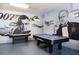 Game room with pool table, air hockey, and movie theme murals at 7554 Marker Ave, Kissimmee, FL 34747
