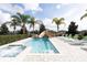 Resort-style pool with slide and spa; lush landscaping and lounge chairs at 7554 Marker Ave, Kissimmee, FL 34747