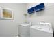 Laundry room with washer, dryer, and shelving unit at 7554 Marker Ave, Kissimmee, FL 34747