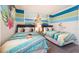 Bedroom with twin beds and Moana theme at 7554 Marker Ave, Kissimmee, FL 34747