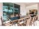 Outdoor patio with table, chairs, and grill; adjacent to pool at 7554 Marker Ave, Kissimmee, FL 34747