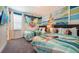 Moana themed bedroom with two twin beds and ocean mural at 7554 Marker Ave, Kissimmee, FL 34747