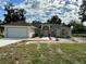 One-story home with attached garage, walkway, and landscaping at 17271 E Peggy Ave. Ave, Mount Dora, FL 32757