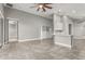 Open concept kitchen with white cabinets, an island, and gray tile floors at 3951 Carrick Bend Dr, Kissimmee, FL 34746
