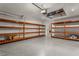 Garage with ample storage shelving and epoxy flooring at 3951 Carrick Bend Dr, Kissimmee, FL 34746