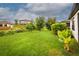 Private backyard showcasing lush landscaping and lawn at 3951 Carrick Bend Dr, Kissimmee, FL 34746