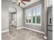 Bright kitchen features stainless steel appliances and white cabinetry at 3951 Carrick Bend Dr, Kissimmee, FL 34746