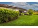 Landscaped backyard with solar panels and lush greenery at 3951 Carrick Bend Dr, Kissimmee, FL 34746