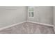 Bright bedroom featuring neutral carpeting and a window with shutters at 3951 Carrick Bend Dr, Kissimmee, FL 34746