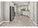 Open concept kitchen with stainless steel appliances at 3951 Carrick Bend Dr, Kissimmee, FL 34746