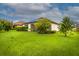 Expansive backyard with mature trees and green lawn at 3951 Carrick Bend Dr, Kissimmee, FL 34746