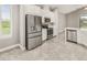 Modern kitchen with stainless steel appliances and white cabinets at 3951 Carrick Bend Dr, Kissimmee, FL 34746
