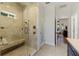 Spacious walk-in shower with built-in bench and glass enclosure at 17577 Davenport Rd, Winter Garden, FL 34787