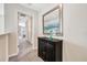 Elegant hallway featuring a console table and artwork at 4782 Kings Castle Cir, Kissimmee, FL 34746