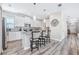 Modern kitchen with white cabinets, granite counters, and stainless steel appliances at 4782 Kings Castle Cir, Kissimmee, FL 34746