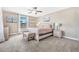 King-size bedroom with carpeted floor and ceiling fan at 4782 Kings Castle Cir, Kissimmee, FL 34746