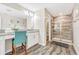 Bathroom with double vanity, walk-in shower, and granite countertop at 4782 Kings Castle Cir, Kissimmee, FL 34746