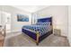 Bedroom with plush velvet headboard, patterned bedding, and a modern nightstand at 4782 Kings Castle Cir, Kissimmee, FL 34746