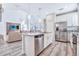 Open kitchen with island, stainless steel appliances, and granite counters at 4782 Kings Castle Cir, Kissimmee, FL 34746
