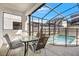 Screened pool area with table and chairs at 4782 Kings Castle Cir, Kissimmee, FL 34746