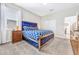 Comfortable bedroom with a blue velvet bed, wood dresser and window at 4782 Kings Castle Cir, Kissimmee, FL 34746