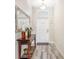 Bright entryway with tile floors and a console table at 4782 Kings Castle Cir, Kissimmee, FL 34746