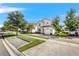 Two story house on a tree lined street with a paver driveway at 4782 Kings Castle Cir, Kissimmee, FL 34746