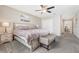 King-size bedroom with carpeted floor and ceiling fan at 4782 Kings Castle Cir, Kissimmee, FL 34746
