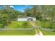 Aerial view of a mobile home on a spacious lot at 141 Autumn Ct, Saint Cloud, FL 34771