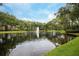 Serene community pond with fountain and lush landscaping at 494 N Pin Oak Pl # 308, Longwood, FL 32779