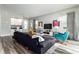 Open living room, stylish furniture, and pool view at 1407 Fairview Cir, Reunion, FL 34747