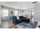 Spacious living area featuring a sectional sofa and large windows at 1407 Fairview Cir, Reunion, FL 34747