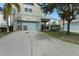 Two-car driveway with ample parking space and landscaping at 1407 Fairview Cir, Reunion, FL 34747